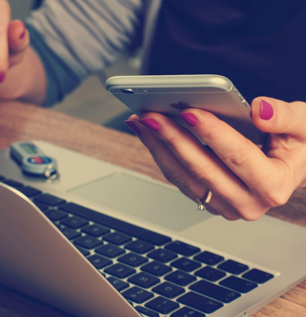 woman holding silver iPhone 6
